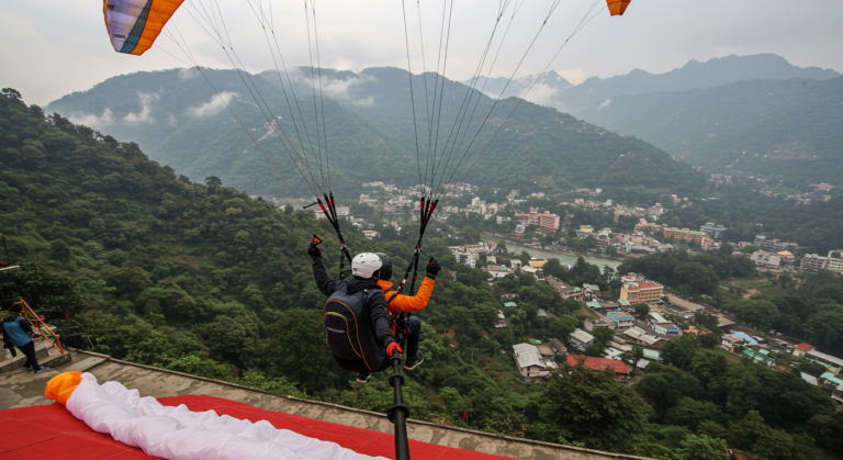 Image for the article 'Discover BUCKETLISTT's Ultimate Thrill: Paragliding in explore all the adventure capital adventures on Bucketlistt' regarding Tourism.